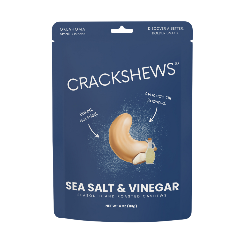 Packaging of Crackshews Sea Salt & Vinegar cashews, 4oz, with a graphic of the cracked nut and text highlighting the flavor and product details.