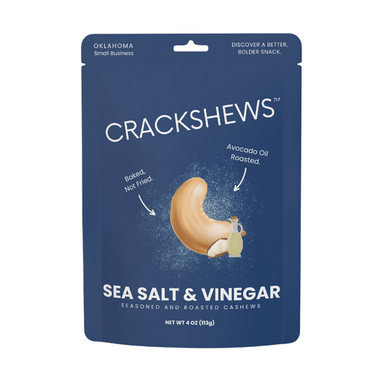 Packaging of Crackshews Sea Salt & Vinegar cashews, 4oz, with a graphic of the cracked nut and text highlighting the flavor and product details.