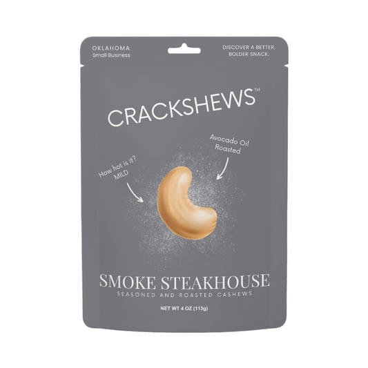 Packaging of Crackshews Smoke Steakhouse cashews, 4oz, with a graphic of the cracked nut and text highlighting the flavor and product details.